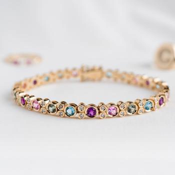 Bracelet in 14 carat gold with diamonds, pink sapphire, green sapphire, blue topaz & amethyst