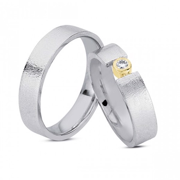 Silver wedding rings with 14 carat gold and 0.05 ct diamonds from Nuran