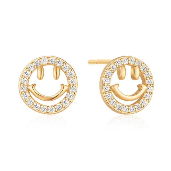 Guldfärgade örhängen med smiley-ansikte och små stenar runt omkretsen.